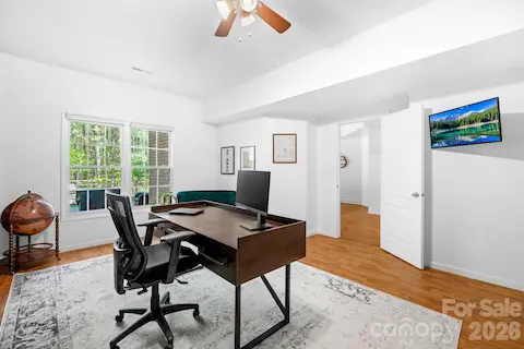 Basement office has views of the backyard and has a storage room/closet.
