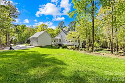Expansive side yard with firepit as well as green space for gardening, cornhole, sports or entertaining!