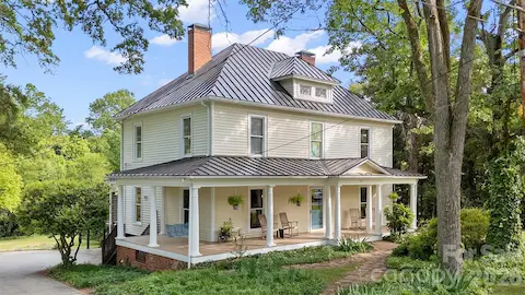Timeless two-story Colonial Revival featuring a wraparound porch with classical columns and a pedimented entry. Ideally located just steps from Davidson College and all that downtown Davidson has to offer.