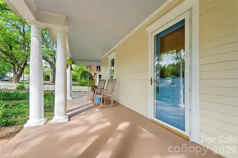 Timeless two-story Colonial Revival featuring a wraparound porch with classical columns and a pedimented entry. Ideally located just steps from Davidson College and all that downtown Davidson has to offer.