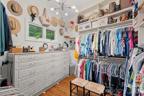 An oversized walk-in closet with custom storage