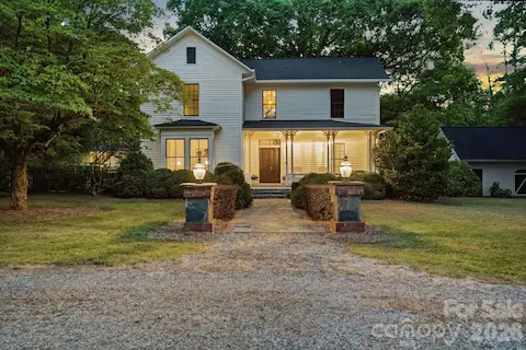 Stone and brick columns greet you at the circular driveway with a brick walk way to the front porch.