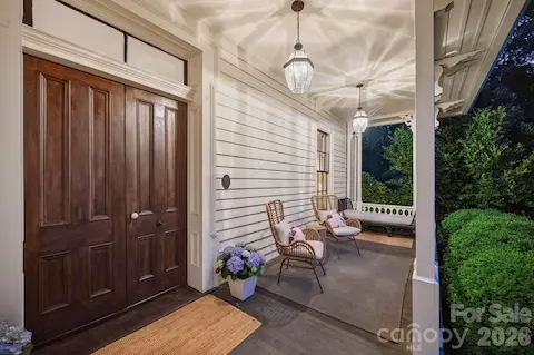 Restored front porch still maintains the Victorian decorative wood work. Original solid wood double front doors w/antique hardware and transom windows