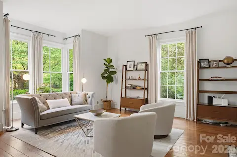 Just off the foyer is what may have been the "Parlor" with the original bay window with sash windows and 6-pane over 6-pane side windows.