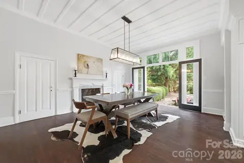 French doors open to flagstone side courtyard ideal for guests to enjoy both indoors and outdoors.  Two large china closets