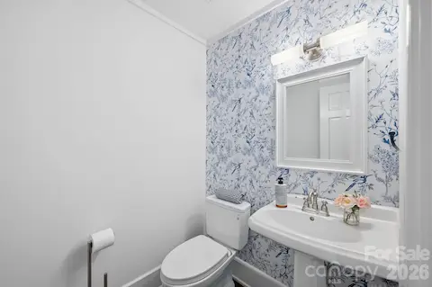 Renovated powder bath just off kitchen and great room.