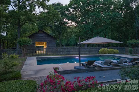 Bocce Ball Court, salt water pool with pebble sheen finish and built-in ledges.  Gardens surround the yard and house and all created by a master gardener