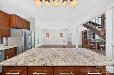 Island offering open flow to Breakfast/Dining area