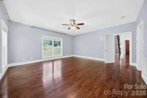 Primary bedroom on Main level features wood floors