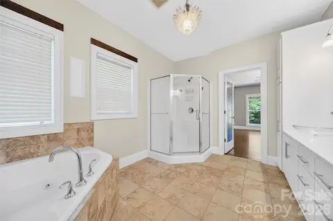 Primary offers a private en suite bathroom providing exclusive access, long wall dual vanities with vessel sinks and deep drawer storage.