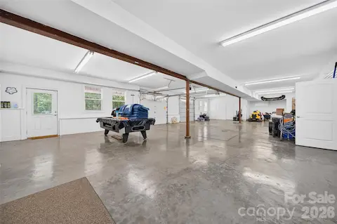 THIS!! Basement offers more than we can list. Finished walls, polished concrete floors, Two entry garage doors, natural light, laundry, multiple storage areas, work shops AND a Full bathroom with walk-in shower. Pool Table conveys!