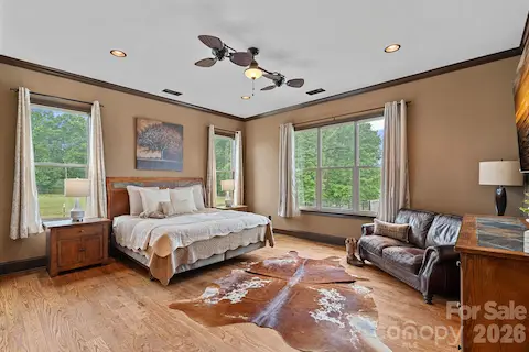 Primary bedroom with incredible property views.