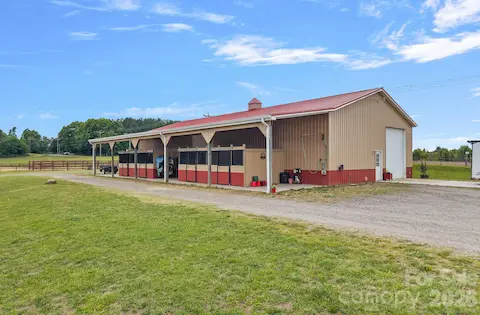 Exterior of automotive workshop has 4 stalls.