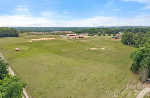 Numerous grazing pastures with 6 water spigots located throughout property.