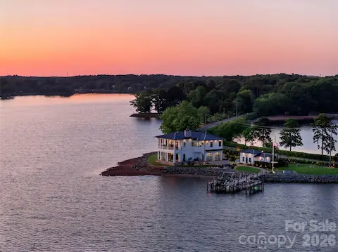 CUSTOM STATIONARY DOUBLE SLIP PIER AND DOCK PERFECTLY LOCATED ON THE 500'+ OF SHORELINE.  BOTH SLIPS HAVE 10,000# LIFTS AND ENGINEERED TILE SYSTEM FLOORING ALONG WITH 2 JET SKI LIFTS.
