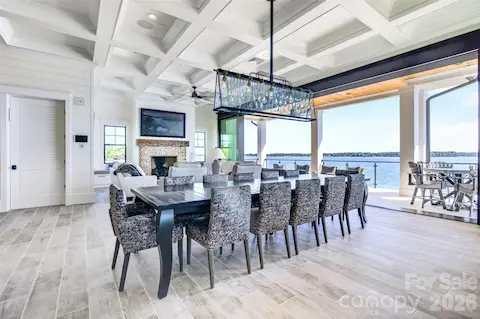 DINE AGAINST A BACKDRIP OF ENDLESS SWEEPING WATER VIEWS IN THIS BANQUET SIZED DINING AREA. DRAMATIC DEEP COFFERED CEILING, INDUSTRIAL-STYLE CHANDELIER JUST A COUPLE OF THE TOP TIER FINISHES