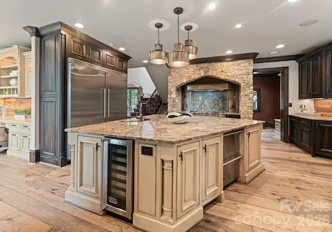 Kitchen featuring Viking appliances, granite counters, and custom cabinetry throughout.