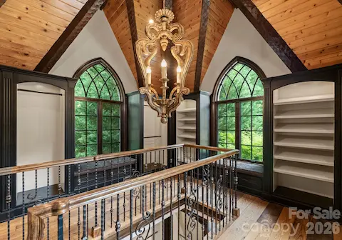 Two-story boutique closet with light-filled luxury storage.