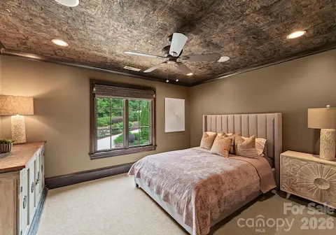 Each Guest Bedroomfeatures TVs, fans, and wallpaper.
