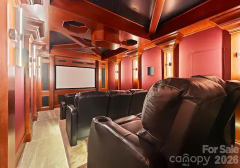 Home Theater with three rows of seating and an immersive starry ceiling.