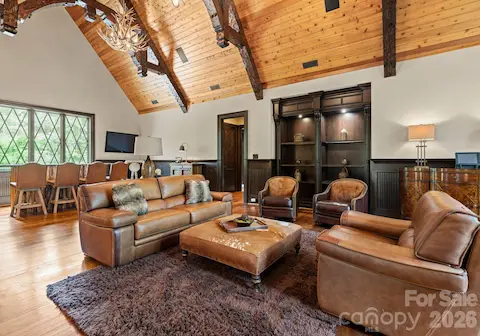 Guest Apartment Living Room is an open-concept space with Samsung TV and built-in shelving.