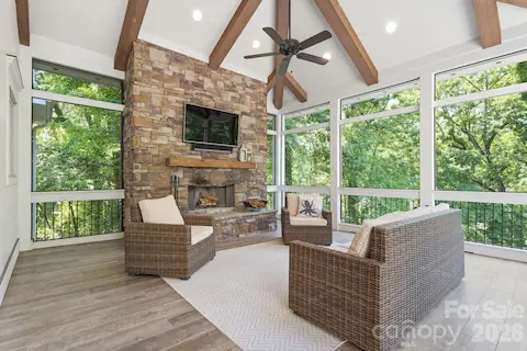Main level screened porch with fireplace
