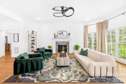 Open living room with fireplace and view of your lovely backyard!