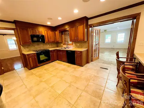Kitchen with view of adjacent Sunroom