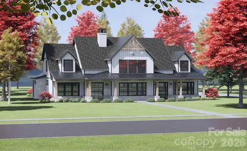 This proposed home is clad in white board-and-batten siding, accented with stonework at the base of the columns and foundation for added texture and elegance.
