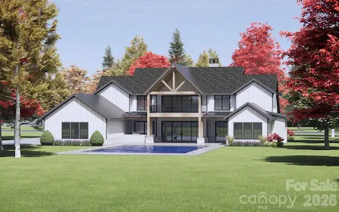 Oversized black-framed windows and sliding glass doors offer panoramic views, infuse the home with natural light, and create a seamless indoor-outdoor flow. (2nd-story porch and pool not included).