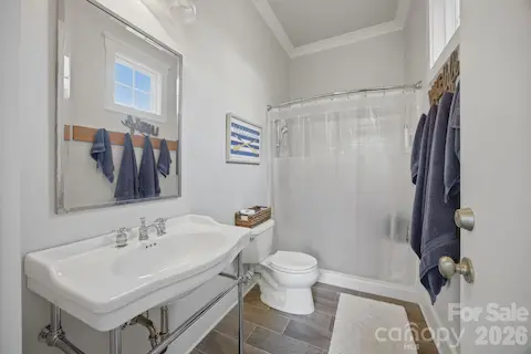 Exterior full bath with convenient outdoor access! Perfect for rinsing off after the lake or pool.
