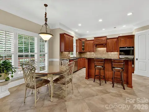 Bright breakfast nook offers serene backyard views, abundant natural light, and an open connection to the kitchen and great room for easy everyday living.
