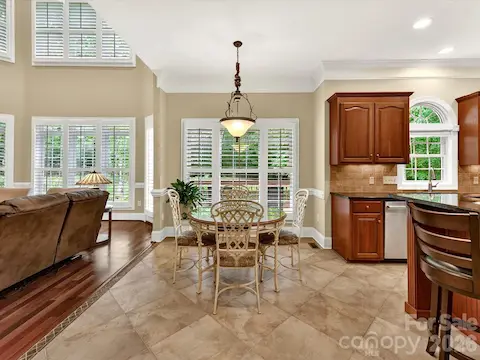 Bright breakfast nook offers serene backyard views, abundant natural light, and an open connection to the kitchen and great room for easy everyday living.