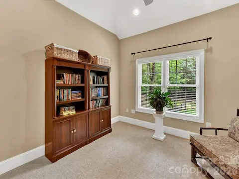 Versatile flex space off the primary suite offers the perfect setting for a sitting room, home office, nursery, or private retreat.
