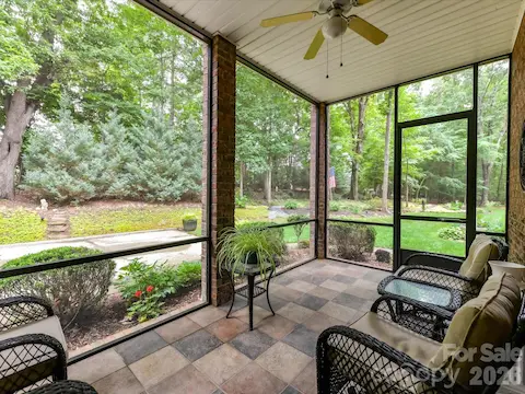 Relax and unwind year-round on the screened porch overlooking the beautifully landscaped, private wooded backyard.