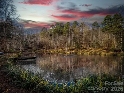 Welcome to 1090 N Saunders! 2 acre spring-fed stocked pond!