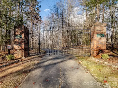 The front entrance is gated, offering peace of mind and a private retreat. The gate, imported from England, exudes timeless elegance.