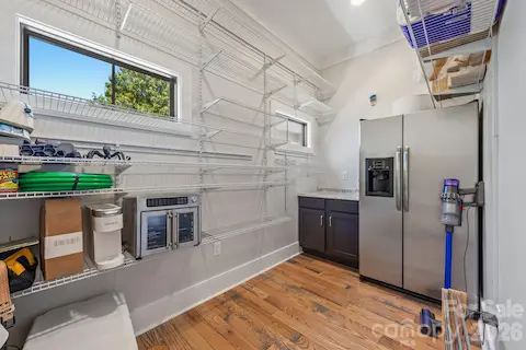 Walk in Pantry by utility room and open concept kitchen