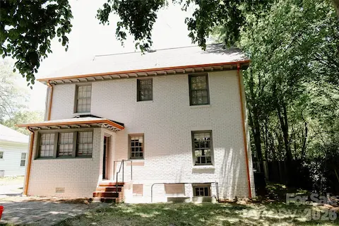 Back of house featuring new gutters
