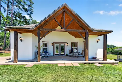 luxury pool home, large porch wood ceiling w/ full view of lake