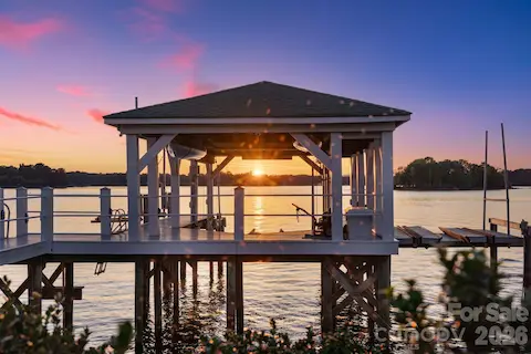 Covered Boat Dock(10,000lbs) and 2 jet ski lifts / 2 kayaks with lifts