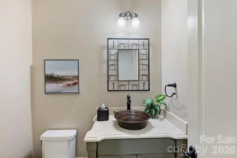 Powder room near back hall/ laundry/garage