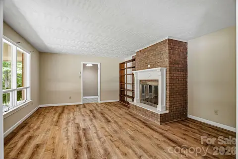 Spacious great room perfect for entertaining or relaxing with family. d plaster ceilings throughout the home bring classic style and character to every room.