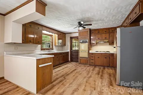 Original wood cabinetry provides character, with room to create your ideal kitchen.