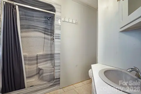 Efficient primary bathroom ready for your personal touch.