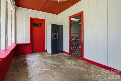 Screened porch that leads to the garage