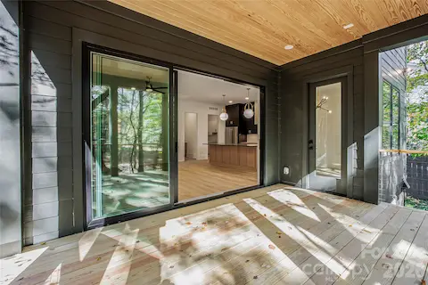 Representative photo of a completed home with the same floorplan. Photos do not reflect the exact finishes.  4003 Sage Cliff will have a screened porch with stamped concrete and gas fireplace.
