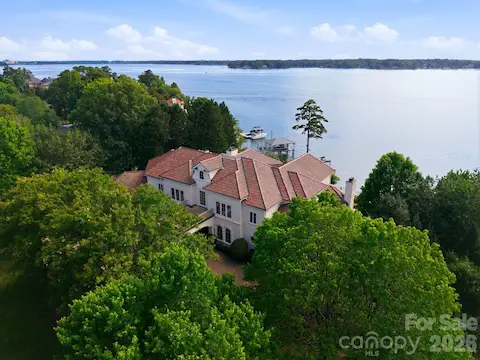 Gently terraced lot cascades to the shoreline