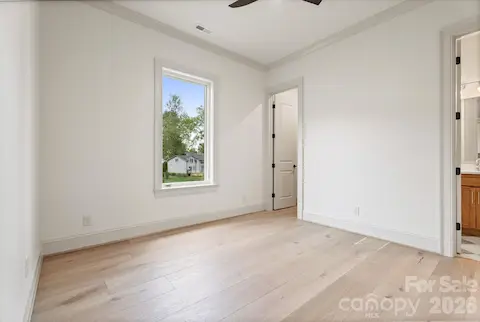 3rd main level guest bedroom with private bath