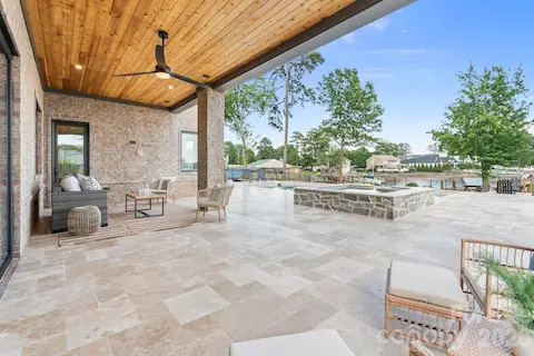 Covered patio with pool and lake views